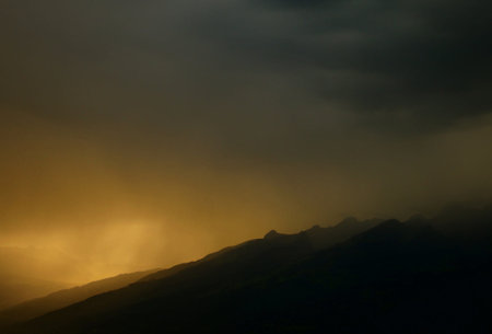 Dramatic stormy sky over the mountains in the morning.