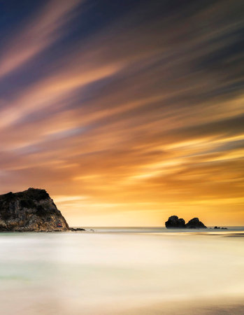 Long exposure of a beautiful sunrise at the beach in Trang, Thailandの写真素材