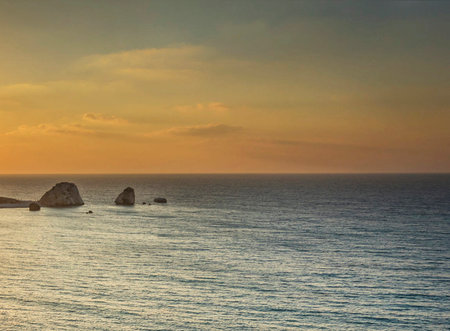 Sunset over the sea with rocks in the foreground, Sardiniaの写真素材