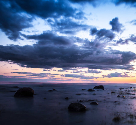 Dramatic sunset over the Baltic Sea. Long exposure photography.の写真素材