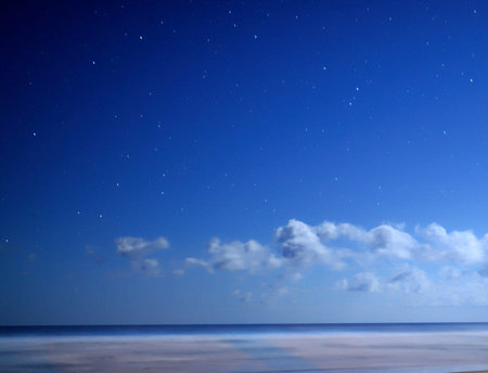 night sky with stars and clouds over the sea. beautiful photo digital pictureの写真素材