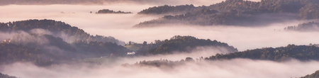 Panoramic view of foggy morning in the Carpathian mountains