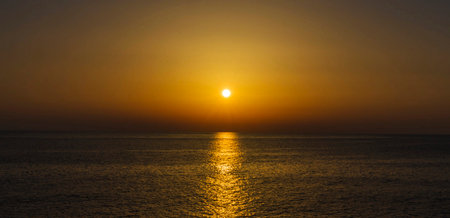 Sunset over the sea. Panoramic view of the sea.の写真素材