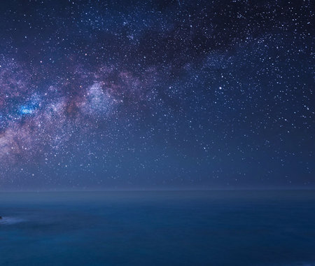 Milky way over the sea with starry sky and copy spaceの写真素材