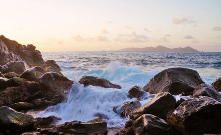 beautiful seascape with rocks and waves at sunset, Thailand