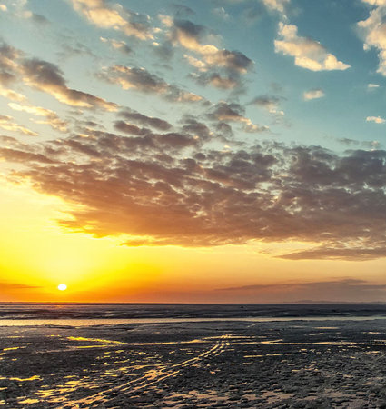 Beautiful sunset over the sea. Dramatic sky. The concept of exotic and ecological tourism