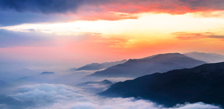 Beautiful sunrise over the mountains in the clouds. Landscape.の写真素材