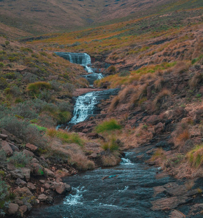 Waterfall in the mountains of New Zealand. Long exposure shot.