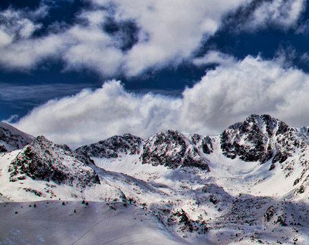 Winter mountains in the clouds. Caucasus Mountains, Georgia, region Gudauri.