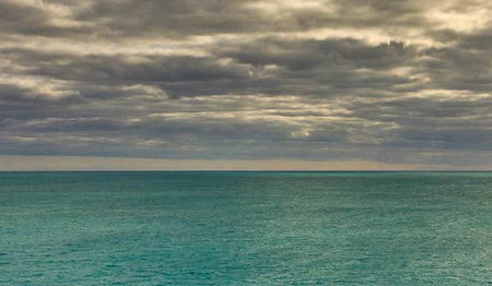 Tropical sea under the cloudy sky. The ocean surface.の写真素材