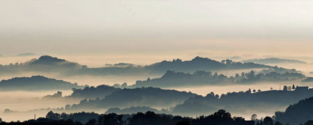 Panoramic view of the morning fog over the hills in the countryside
