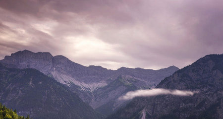 Panoramic view of the mountain range in the clouds. Dolomites, Italy