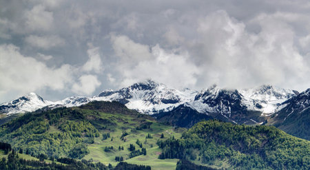 panoramic view of the Swiss Alps with snow-capped peaksの写真素材
