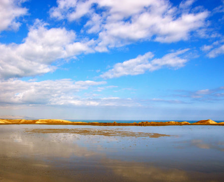 beautiful seascape on a background of blue sky with cloudsの写真素材