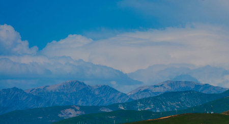Mountains and blue sky with white clouds. Landscape in the mountains.の写真素材