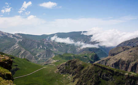 Mountain landscape with clouds and blue sky. Caucasus, Georgia.