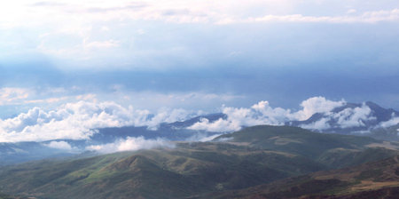 Mountains and clouds in the early morning. Panoramic viewの写真素材