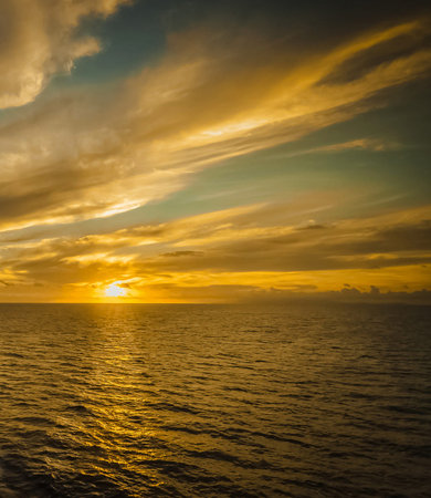 Beautiful sunset over the sea with clouds and rays of light.の写真素材