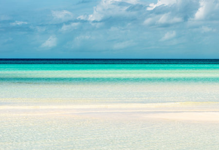 Tropical beach with white sand and turquoise water.