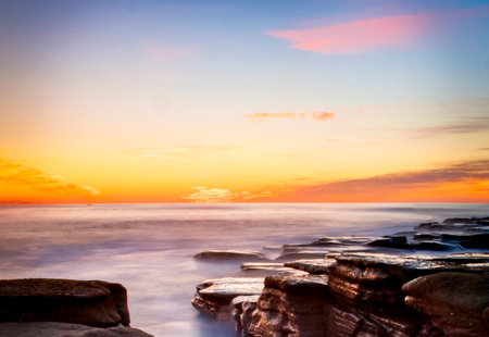 Beautiful sunset on the beach. Sunset over the sea. Beautiful seascape.