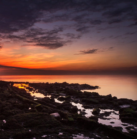 Beautiful sunset over the sea. Nature composition. Toned.の写真素材