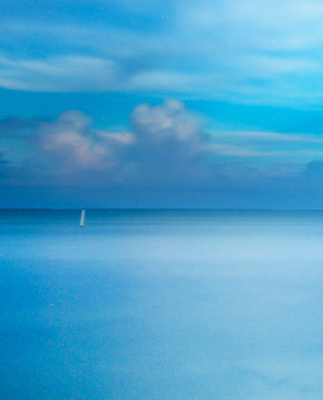 Blue sky with clouds over the sea in the evening, Thailand.の写真素材
