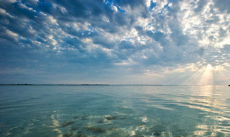 Beautiful seascape with blue sky and clouds at sunset.の写真素材