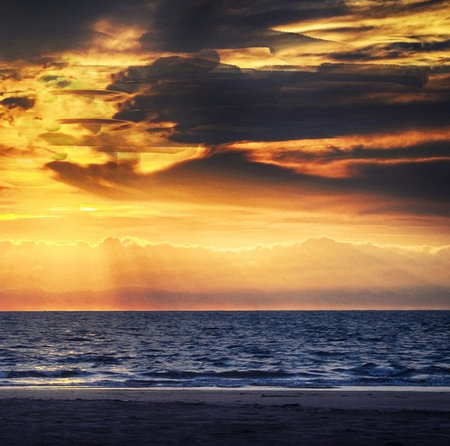 Beautiful sunset over the sea. Sunset on the beach. Sky and clouds.