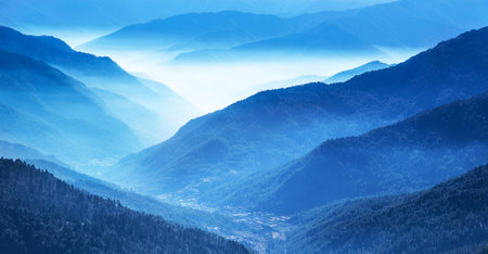Beautiful mountain landscape with fog in the morning. Carpathians, Ukraine, Europe.