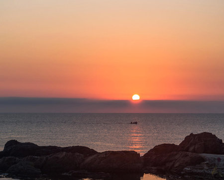 Beautiful sunset over the sea. The sun goes down over the sea.の写真素材