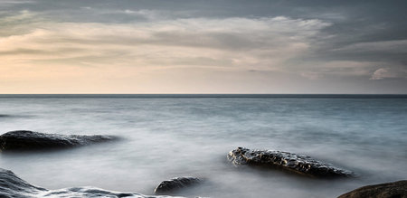 Long exposure seascape with rocks and long exposure of the seaの写真素材