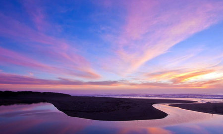 Beautiful sunset on the beach, blue sky and purple clouds.の写真素材