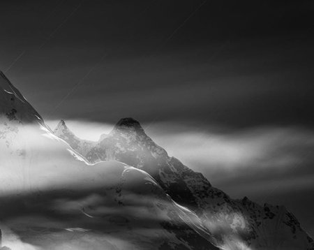 Black and white view of snowy mountains. Caucasus Mountains, Georgia, region Gudauri.