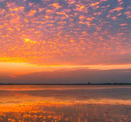 Beautiful sunset at the lake with colorful sky and cloud, Thailand.の写真素材