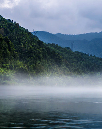 Landscape of mountain and river in the morning with fog, Thailand.