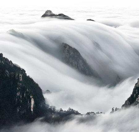 Mountain landscape with fog in Huangshan National Park, Chinaの写真素材