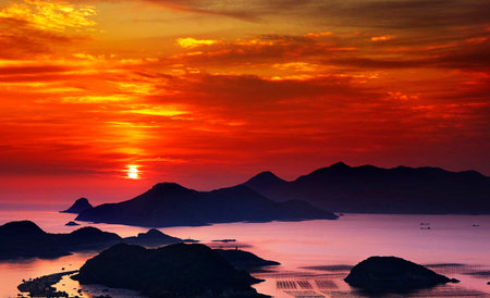 Beautiful sunset over the sea and mountains. View from above.の写真素材