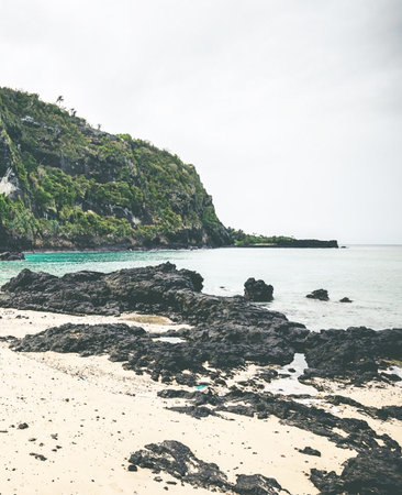 Tropical beach with rocks and turquoise water - Vintage Filterの写真素材