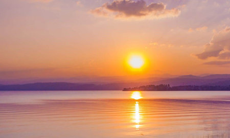 Sunset over the lake. Beautiful sunset over the lake. Sunset over the lake.の写真素材