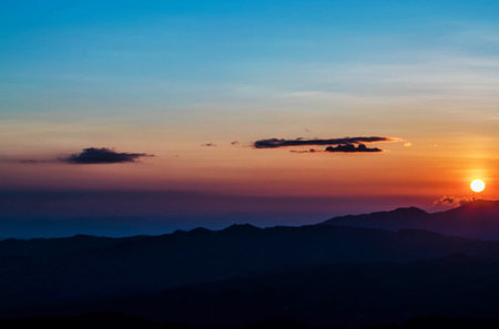 Beautiful sunset over the mountain range in the morning, Thailand.