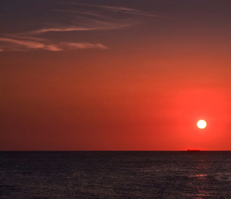 Sunset over the sea in the tropics. Red sunset over the sea.の写真素材