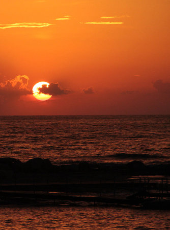 Sunset over the sea in the tropics. The sun goes down.の写真素材
