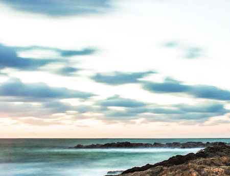 beautiful seascape with rocks and sea at sunset. long exposureの写真素材