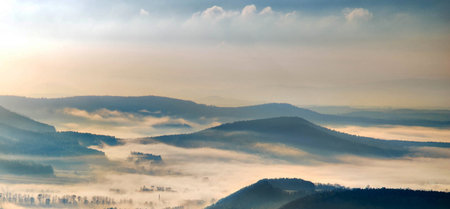 Foggy morning in the mountains. Panoramic view.