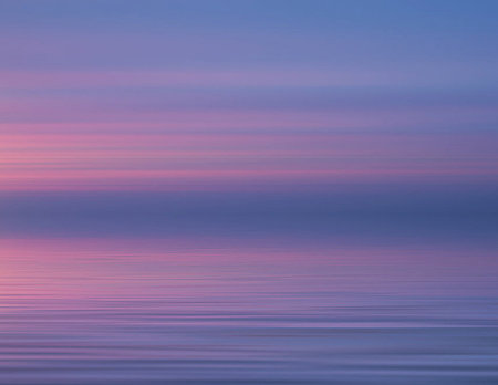 beautiful sunset over the sea, pink and purple colors, long exposureの写真素材