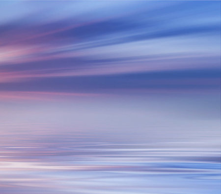 abstract background with smooth water surface and pink and blue sky.の写真素材