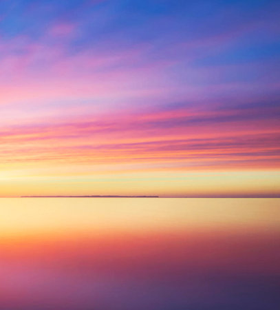 Beautiful sunset over the sea. Colorful sky and sea.の写真素材