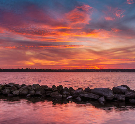 Beautiful sunset over the river in the summer. Colorful skyの写真素材