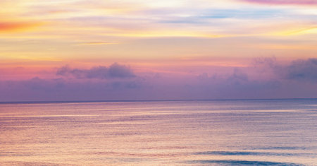 Beautiful sunset over the sea. Panoramic view of the sea at sunset.