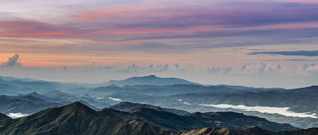 Sunrise in the mountains. Panorama of the mountain range.の写真素材